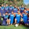 Il team Ondulor posa sul campo da calcio durante il torneo aziendale Aziende in Campo a Oristano.